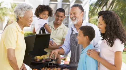 family enjoying a barbeque bbq